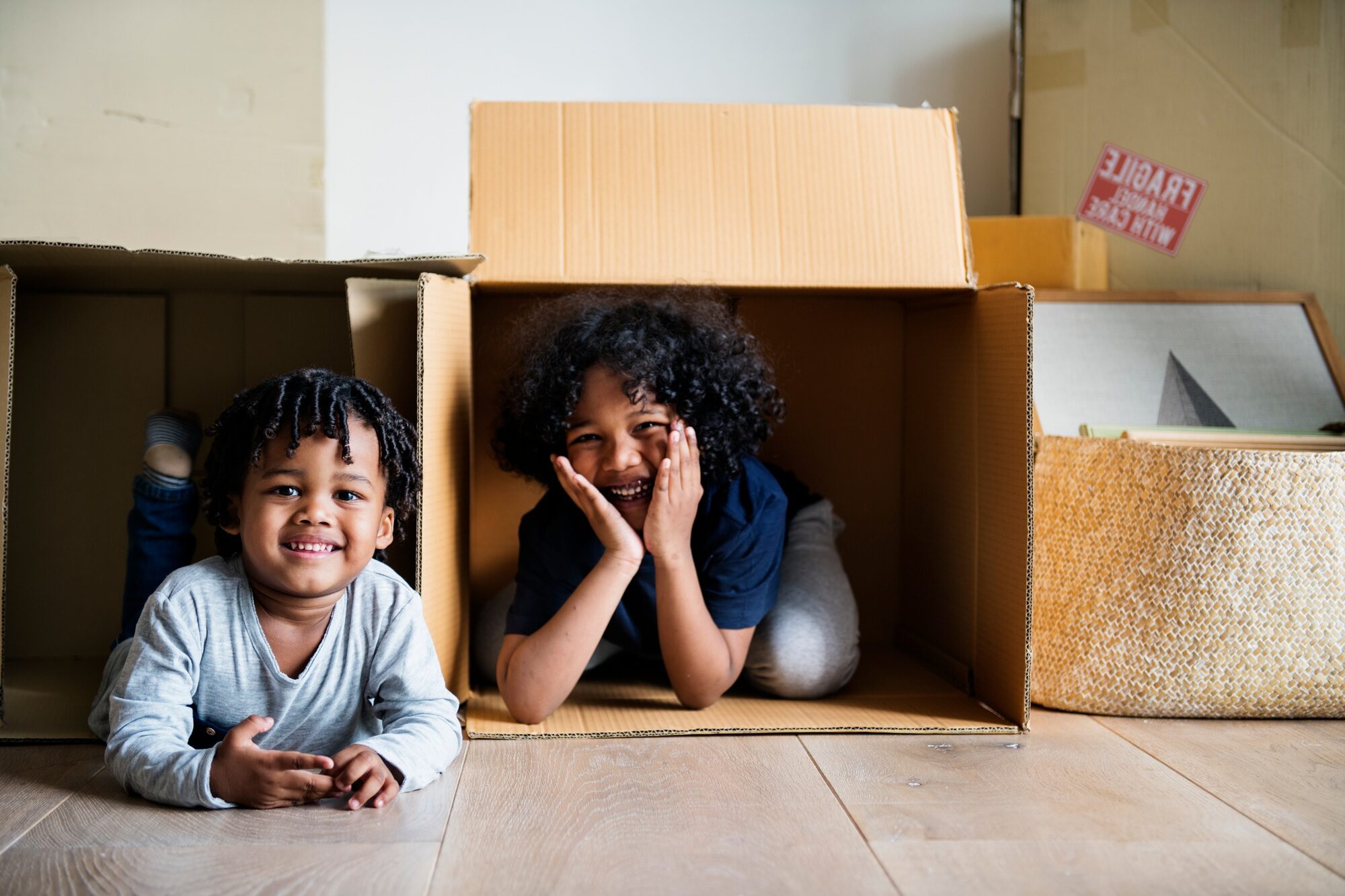 Young African kids moving to new house